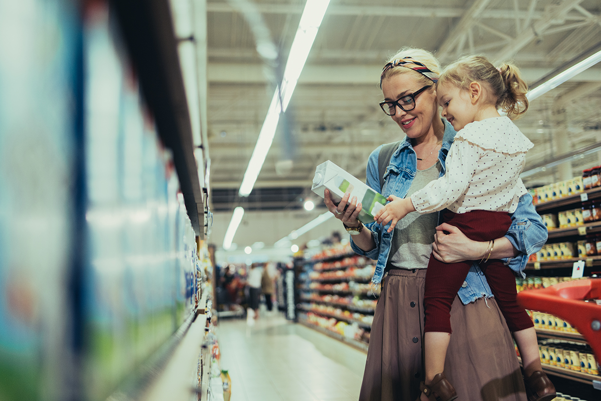Mom and Daughter Shopping Together in the Supermarket